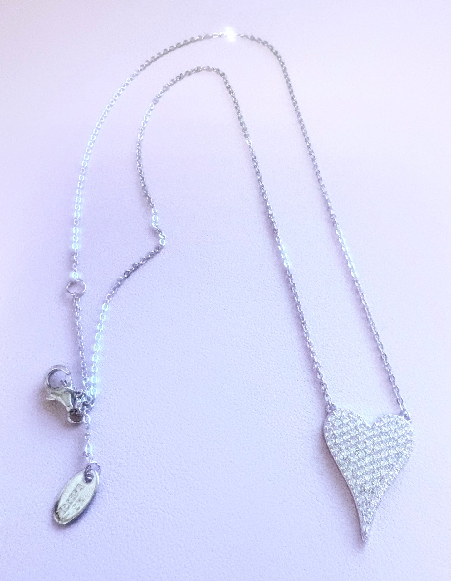 Silver heart necklace encrusted with tiny stones